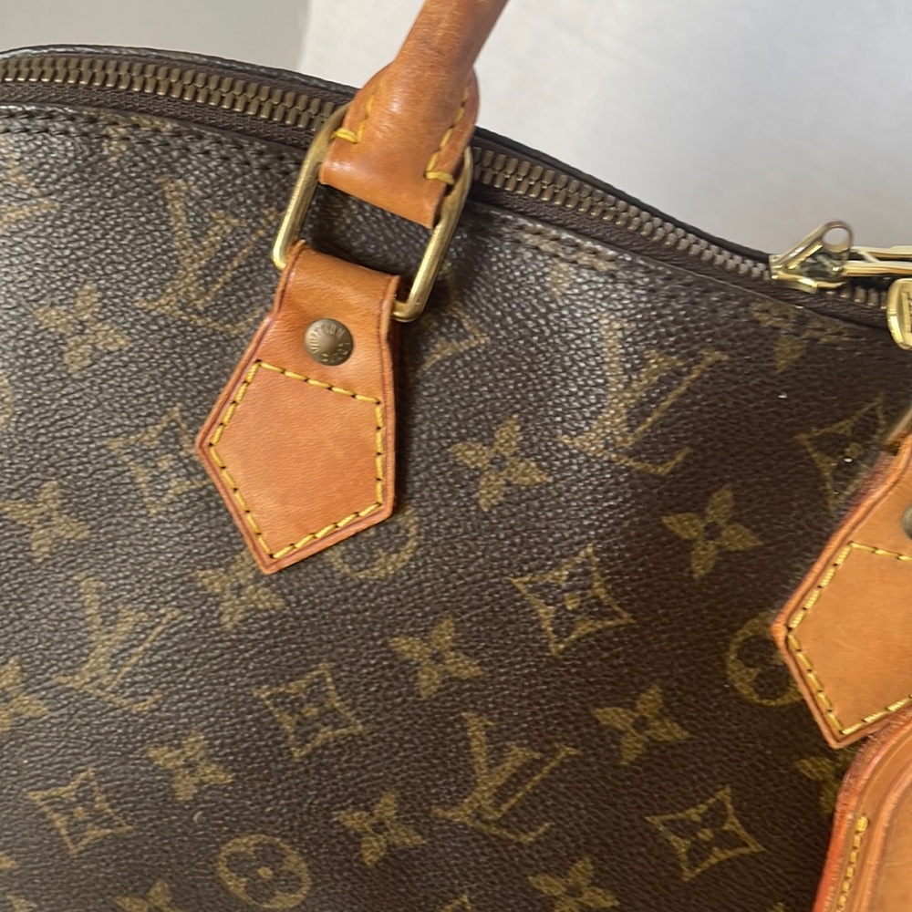 Authentic LOUIS VUITTON Alma Monogram Handbag - Picture 11 of 17